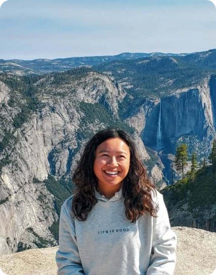 woman with mountains behind her